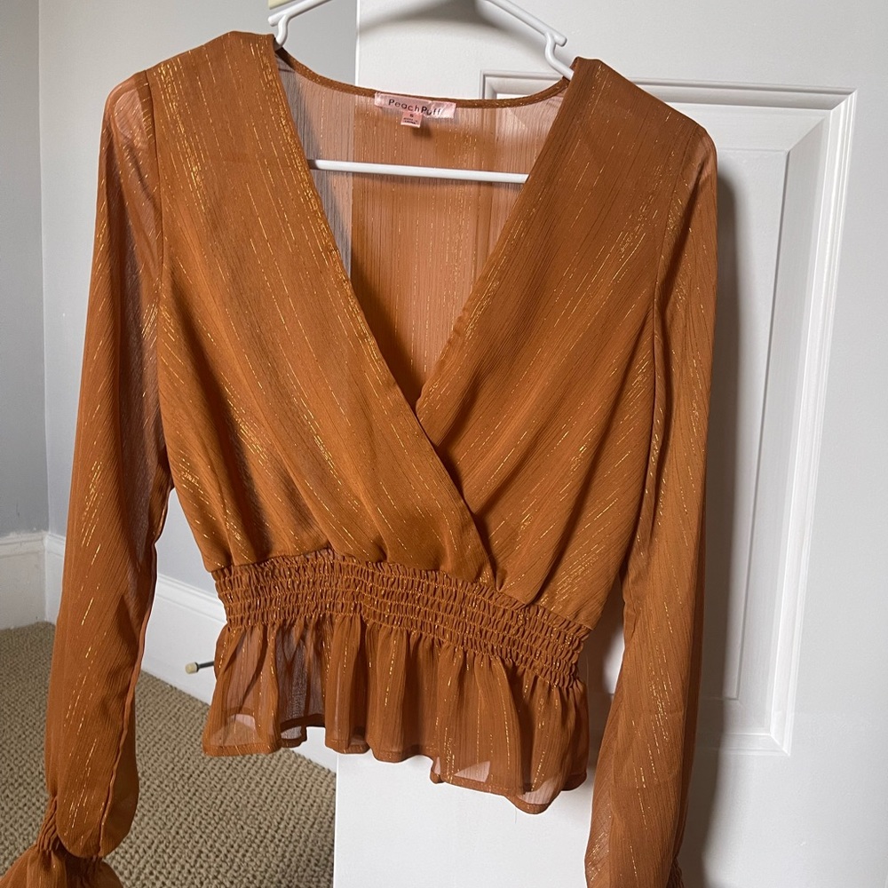 small brown and gold long sleeve top